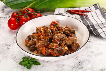 Baked chicken hearts with vegetables