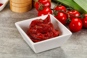 Red tomato paste in the bowl