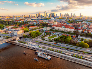 Warsaw old city center and skyscrapers in the background Vistula river. Sunset in Warsaw city...