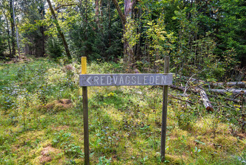 Directions sign on a hiking trail in a woodland