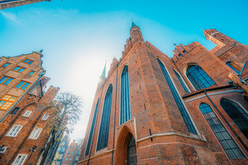 Gdansk with Motlawa river in Poland. Old town colourful house with saint Marys church i main square.