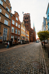 Gdansk with Motlawa river in Poland. Old town colourful house with saint Marys church i main square.