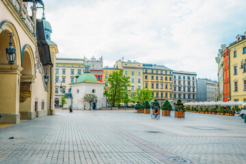 Main street Rynek Głowny in Krakow with square and church St. Mary's Basilica in Poland