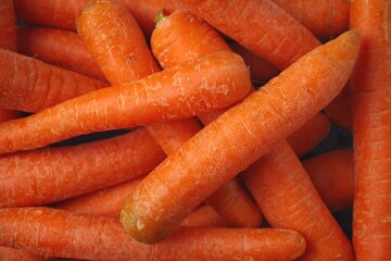 Fresh organic carrots shot from above. Background texture. 