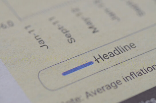 Close-Up of “Headline” Term on Financial Report Representing Key Market Metrics - Powered by Adobe