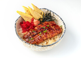 Grilled eel served on rice with tamagoyaki, pickled ginger, seaweed, and red pickles in ceramic bowl, showcasing traditional Japanese dish with vibrant colors and textures
