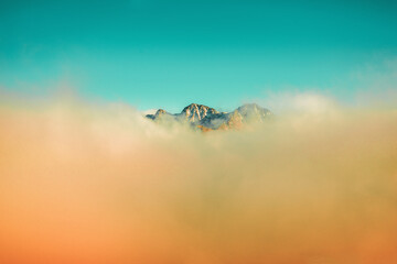 Mountains minimalist landscape. Peaks of the mountains above the clouds. Pyrenees, Andorra, Europe