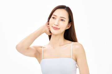 髪をかきあげる女性　スキンケア