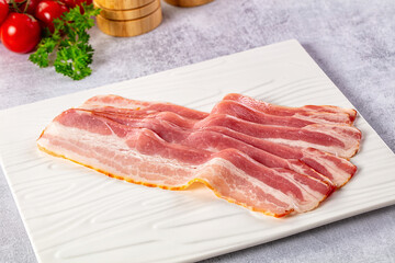 Raw bacon pork meat slices