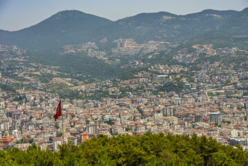 Drone view of Alanya city, Turkey. Coastline, Mediterranean Sea, harbor, historic castle on the...