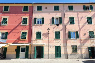 Naklejka premium Old street in Italian countryside near sea. Traditional building. Sun day. Entrance, window to house. Nature and sky.