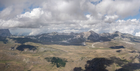 aerial landscape with Laga mountain range and barren upland, L'Aquila, Italy