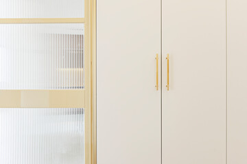 Contemporary luxury: high-end chrome door handle with perfect linear form against white lacquered...