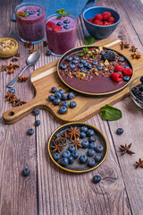 A photograph of red and purple tones: blueberries, currants, and a thick juice invites you to enjoy nature
