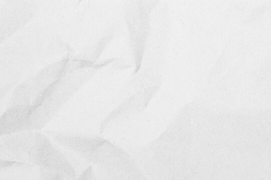 White recycled craft paper texture as background. Grey paper texture, Old vintage page or grunge vignette of old newspaper. Pattern rough art creased grunge letter. Hardboard with copy space for text.