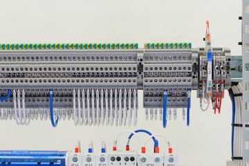 Electrical screw terminals for connecting wires in an electrical switchboard. Soft focus. Close-up.