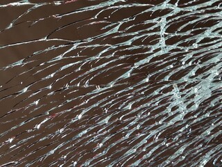 abstract background with spider web on broken mirror