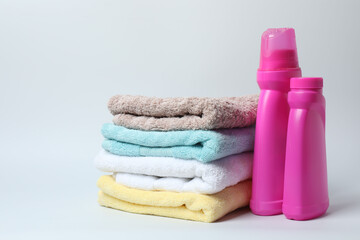 Towel and bathroom accessories on a white background