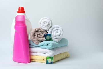 Towel and bathroom accessories on a white background