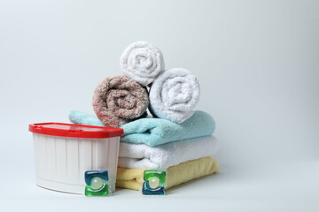 Towel and bathroom accessories on a white background
