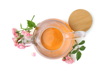 Tasty rose tea in glass teapot, flowers and sprig with leaves isolated on white, top view