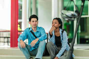Diverse College Students Chatting Beside Electric Scooter