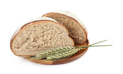 Pieces of fresh bread and green wheat spikes isolated on white