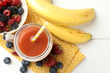 Superfood. Healthy drink in mason jar and ingredients on white wooden table, flat lay