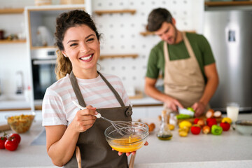 Professional success personal chef cook in customer private kitchen giving cooking lesson to people