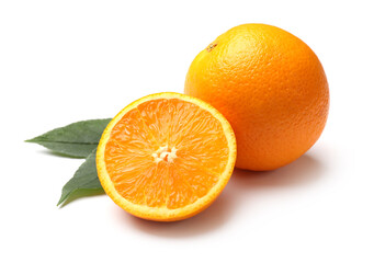 Whole, cut oranges and green leaves isolated on white