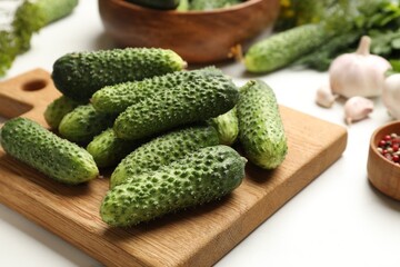 Making pickles. Fresh cucumbers on white table, closeup