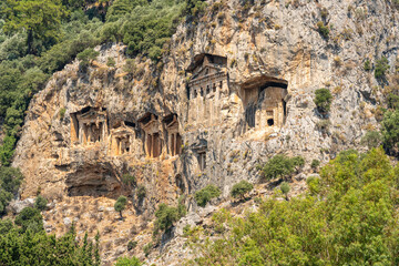 Ancient Lycian rock tombs of Kaunos carved into cliffs in Dalyan, Turkey