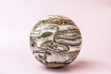 Detailed view of polished agate sphere showcasing its intricate patterns and captivating colors....