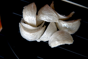 wrapped nests directly represents a stage in the supply chain where the product is prepared for commercial distribution, emphasizing the importance of presentation and preservation for a high-value,