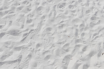Fine white sand that glistens and reflects the sunlight.