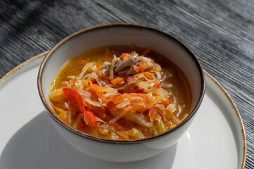A bowl of shchi soup in a cafe. 