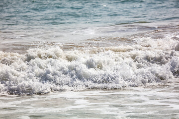 The ocean is calm and the waves are small