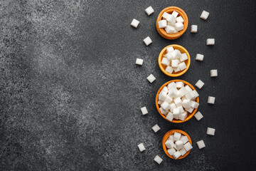Creative arrangement of sugar cubes on colorful coasters at a dessert table