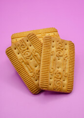 Enjoy delicious cookies on a vibrant pink background, perfect for snack time advertising or food...