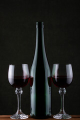 Still life with glasses of wine and glass bottle