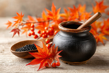 Rustic tea set with maple leaves on wooden surface