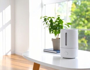 A desktop humidifier running beside a small plant and stationery on a white table,