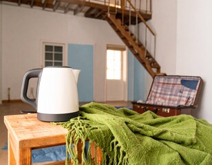 A portable electric kettle heating water in a small Airbnb-style room with a compact 