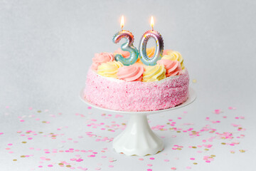 Celebrating a milestone birthday with a pink and yellow 30th birthday cake