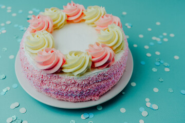 Delightful colorful cake with creamy frosting on a pastel background
