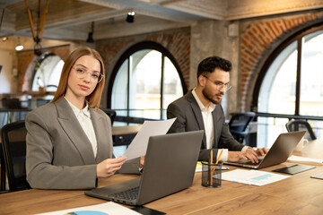 Male and female managers working together in the office