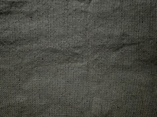 closeup of textured gray linen fabric with natural weave pattern for upholstery or textile design...