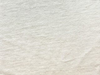 soft beige cotton fabric texture with subtle knit pattern ideal for textile backgrounds and product...