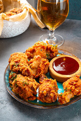Fried chicken wing and bbq souse and beer close up vertical photo