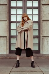 young woman in a coat